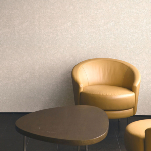 Beige wallpaper with golden armchair and round brown coffee table