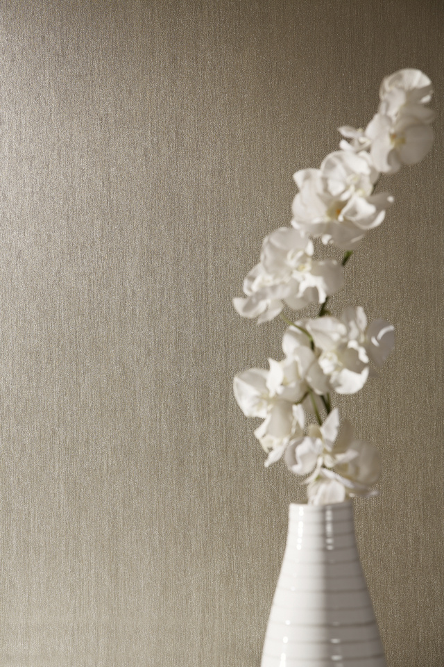 Brown embossed wallpaper with flower and white vase