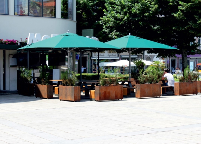 Outdoor terrace with green parasols